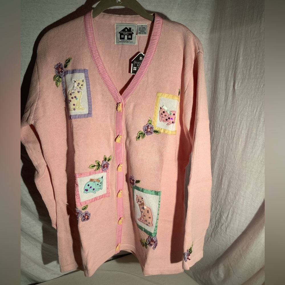 Storybook knit titled “Calico Cats”.